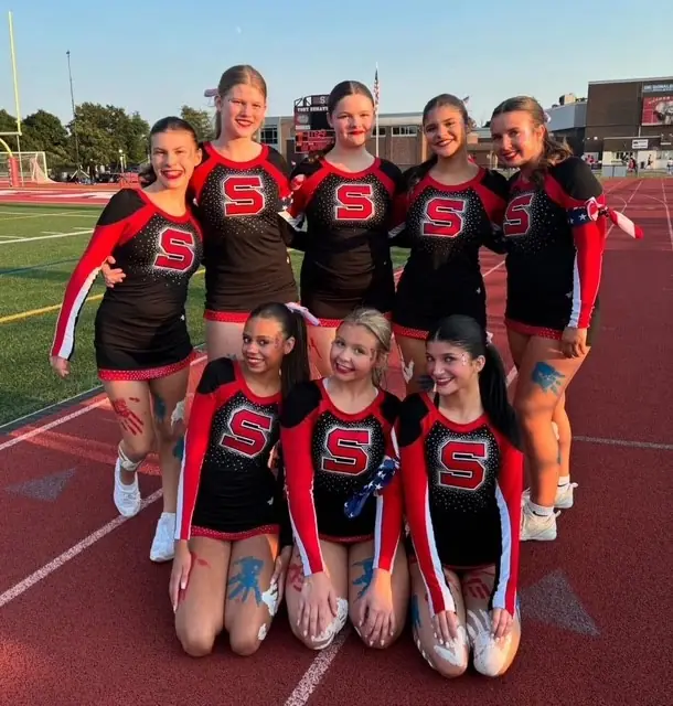 Somers cheerleaders showing school spirit on the track